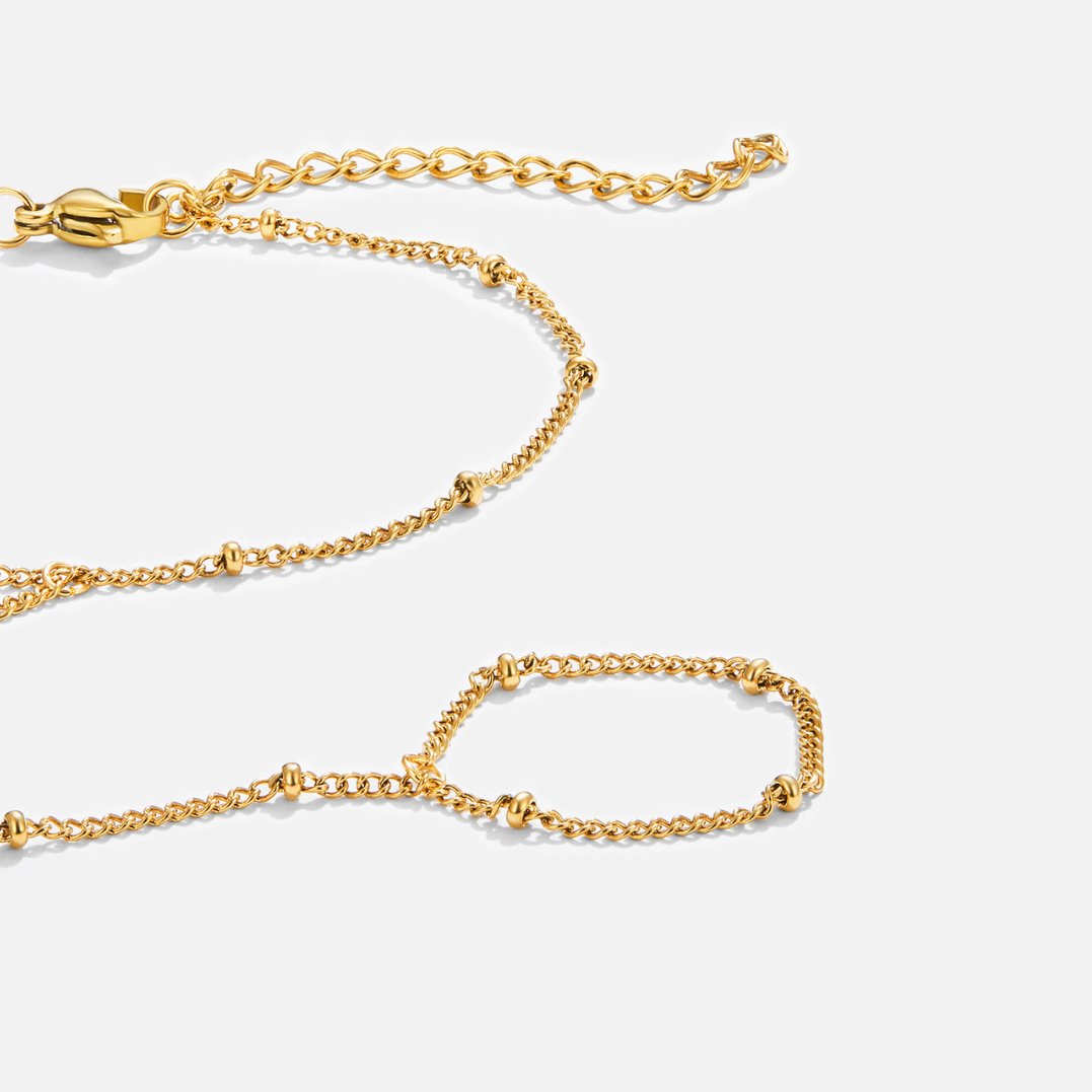 Elegant guldarmbånd med raffinerede detaljer