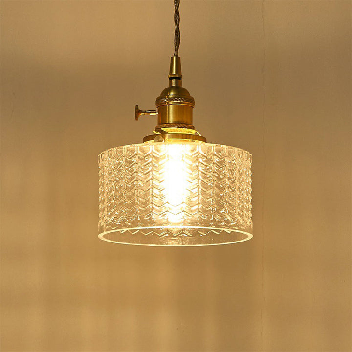 Kort cylindrisk retro pendellampe i bølget glas, klar/grøn med messing drejekontakt