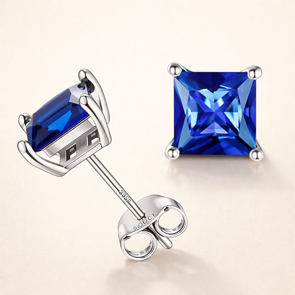 Elegante øreringe i hvidguld med safir i prinsessesliben