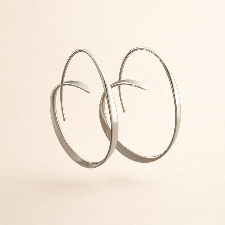 Elegante guldøreringe med en raffineret spiralform