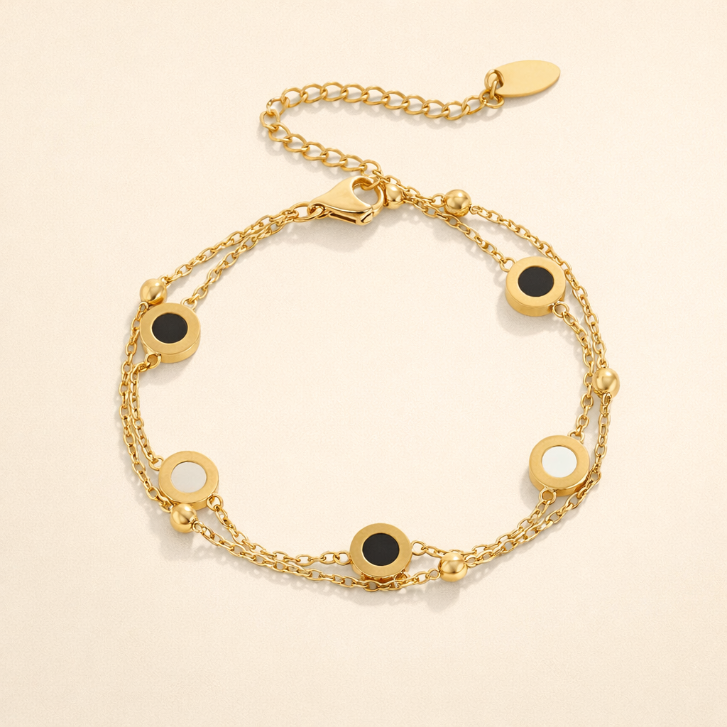 Elegant armbånd med onyx og hvide sten