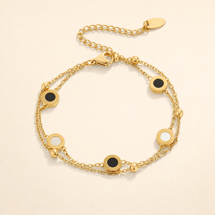 Elegant armbånd med onyx og hvide sten
