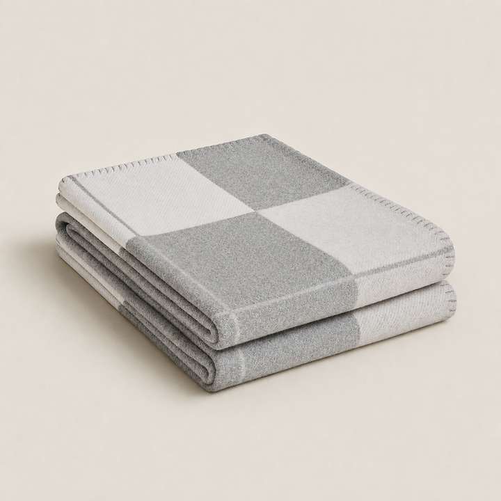Elegant tæppe i uld og cashmere til et luksuriøst hjem