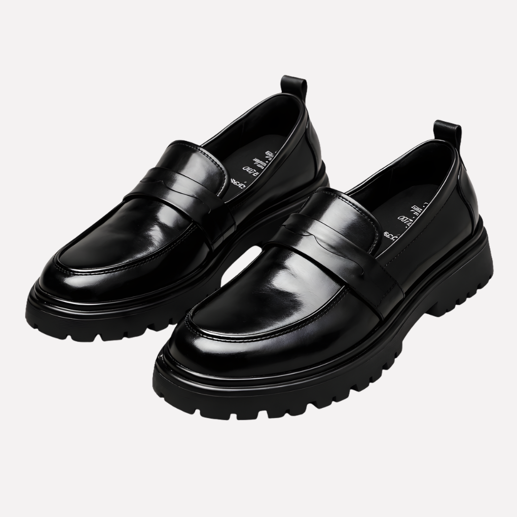 Herreloafers i læder med penny-rem og mock-toe-mønster
