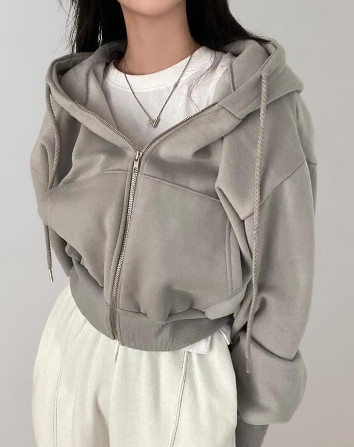 Hoodie til damer med lynlås og hætte med snoretræk samt ribbede manchetter