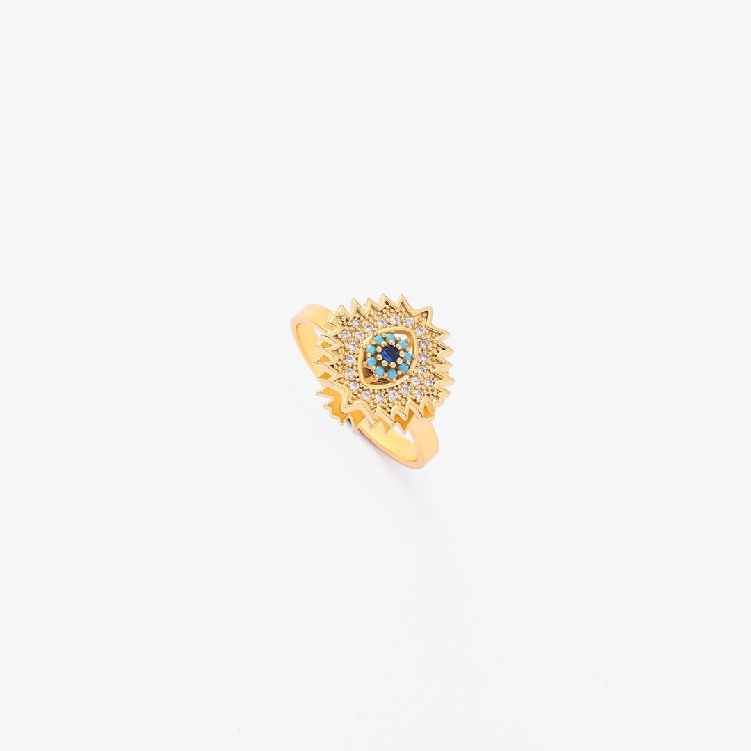 Guld drejering med safir og solstrålesdesign