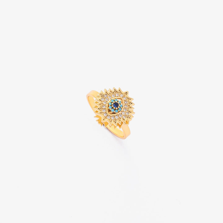Guld drejering med safir og solstrålesdesign