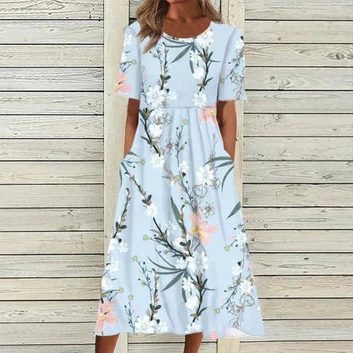 https://cdn.shopify.com/s/files/1/0575/0731/5784/files/blomstret-maxi-kjole-i-gul-og-lysebla-elegant-og-afslappet-stil-perfekt-til-bade-formelle-og-afslapp-3.webp?v=1748707529