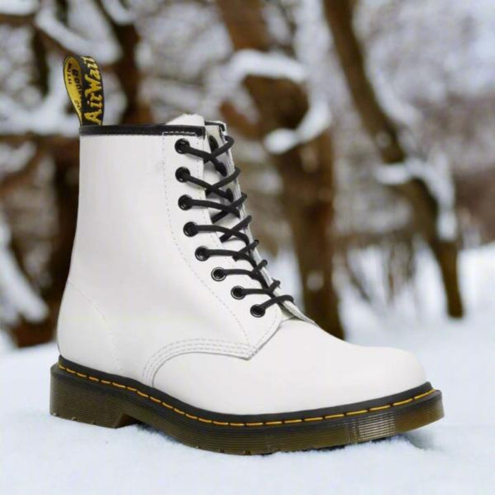 Elegant women's lace-up boots with durable leather, sleek design, and versatile style for comfort and sophistication.