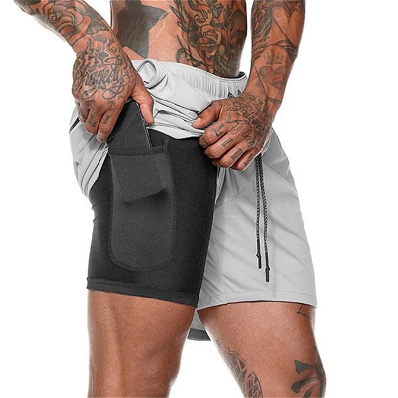 https://cdn.shopify.com/s/files/1/0575/0731/5784/files/m-nds-2-i-1-tr-ningsshorts-med-mobillomme-ideelle--4.jpg?v=1778637521