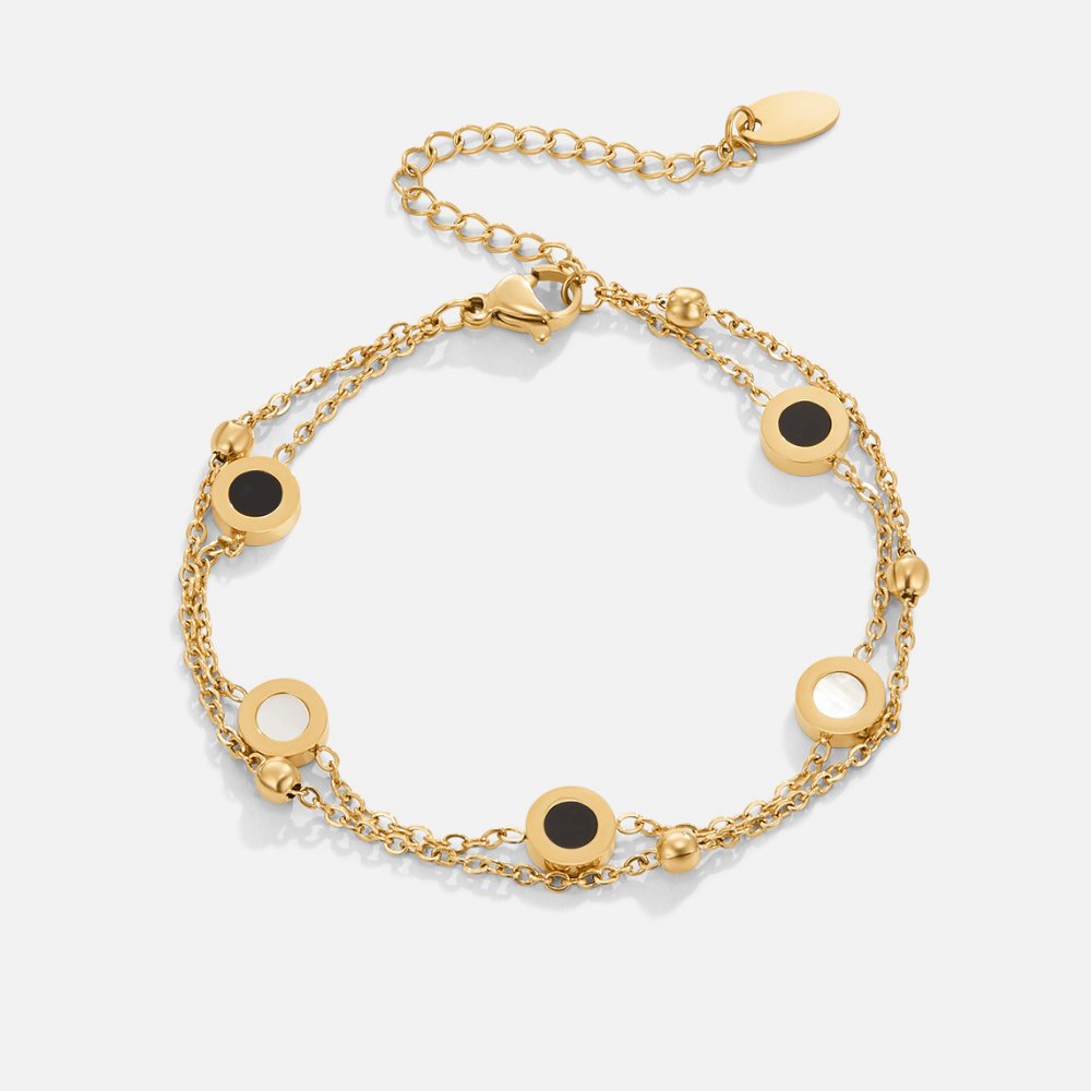 Elegant armbånd med onyx og hvide sten