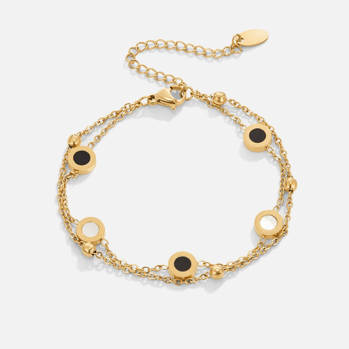 Elegant armbånd med onyx og hvide sten