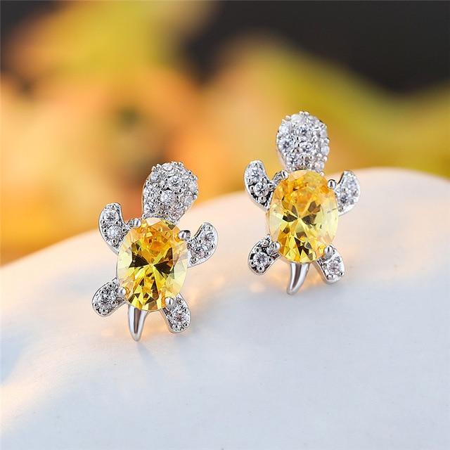 Elegante sølvøreringe med zirkonia og tangdesign