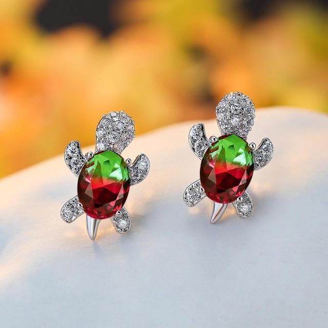 Elegante sølvøreringe med zirkonia og tangdesign