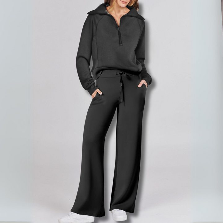 https://cdn.shopify.com/s/files/1/0575/0731/5784/files/stilfuld-joggingdragt-med-lynlastroje-og-brede-bukseben-i-blodt-stof-ideel-til-bade-afslapning-og-hv-3.png?v=1748715243