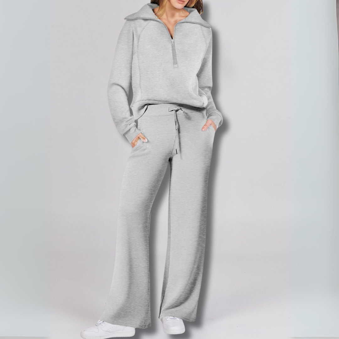 https://cdn.shopify.com/s/files/1/0575/0731/5784/files/stilfuld-joggingdragt-med-lynlastroje-og-brede-bukseben-i-blodt-stof-ideel-til-bade-afslapning-og-hv-4.png?v=1748715246